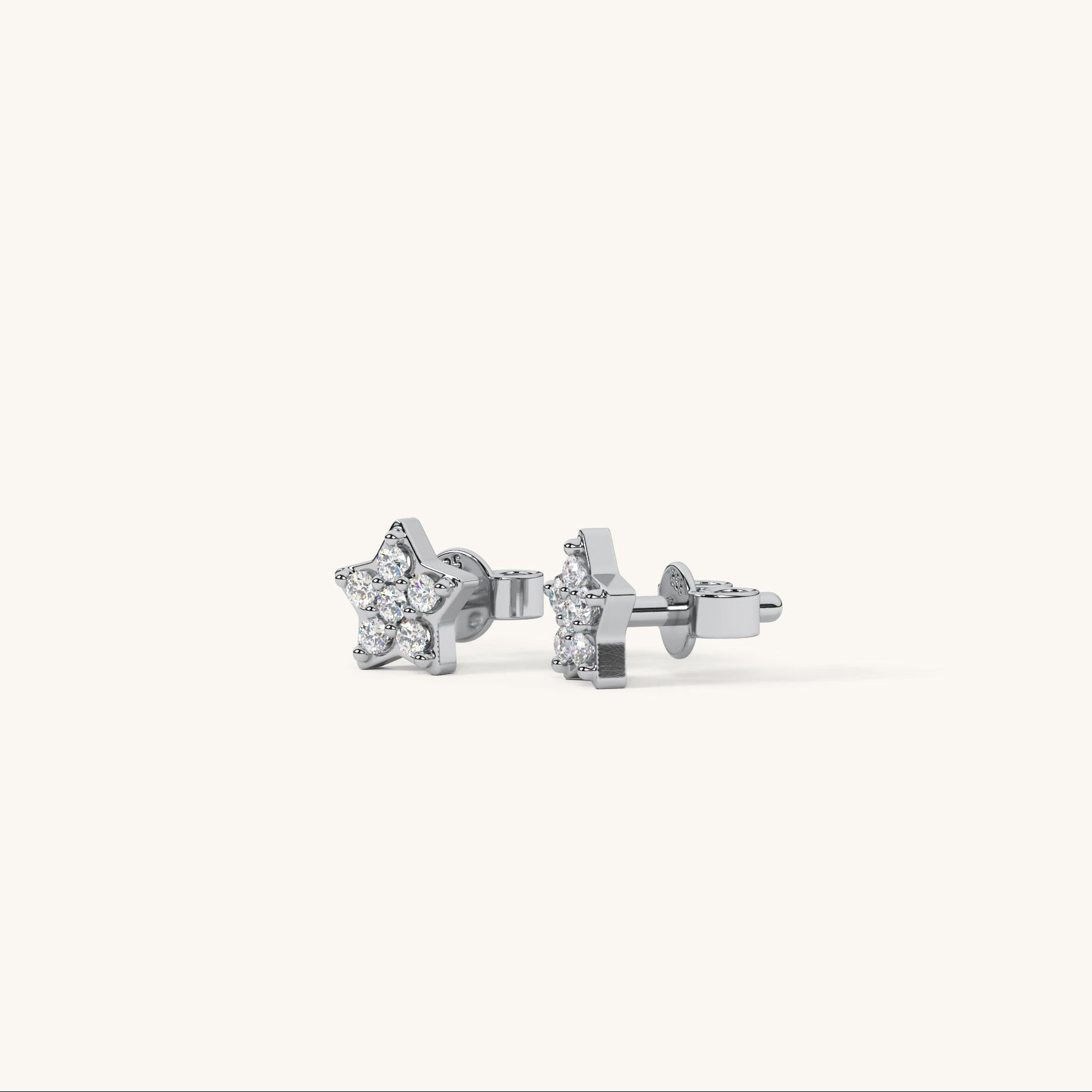 Pair of silver star-shaped earrings on a white background