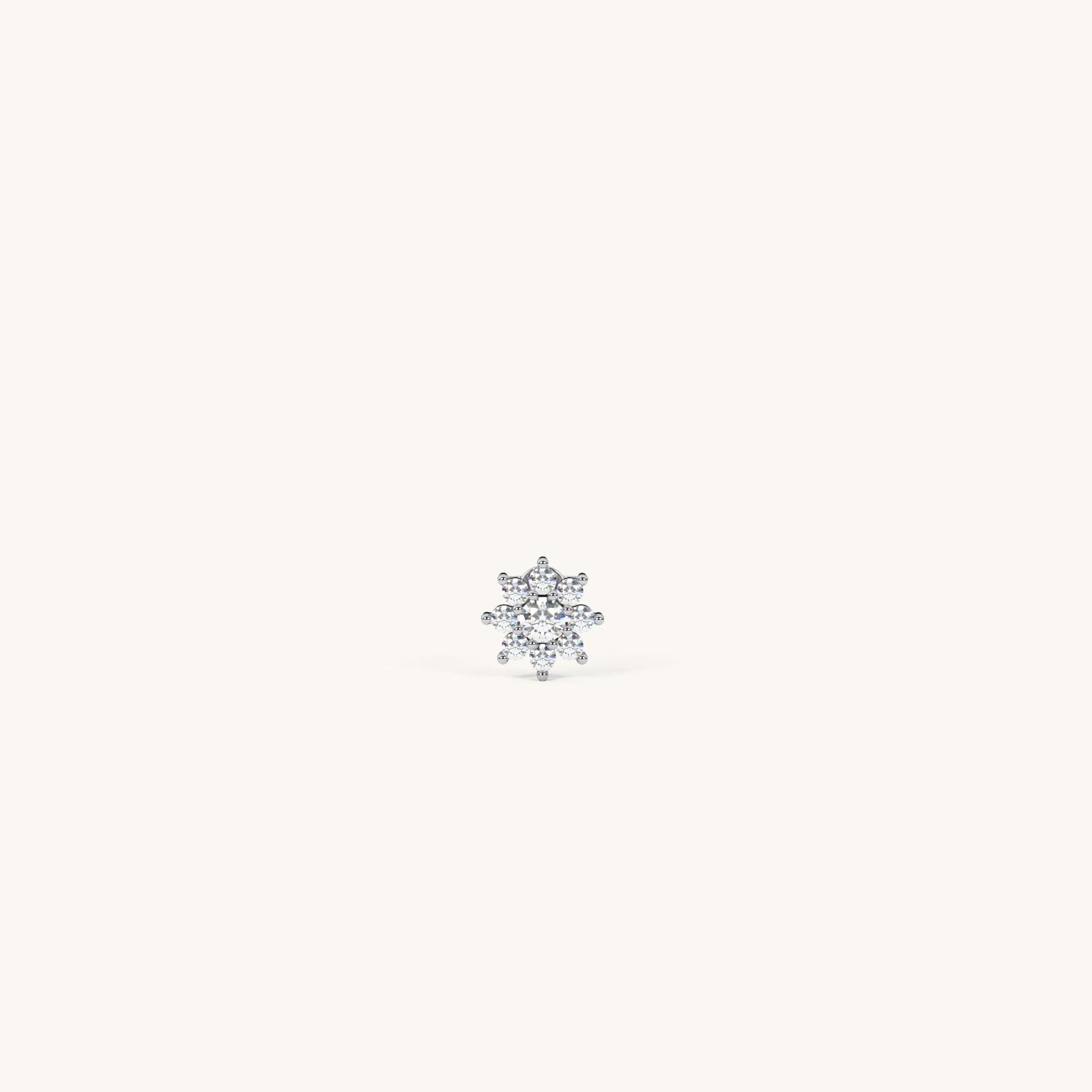 Single diamond earring on a white background
