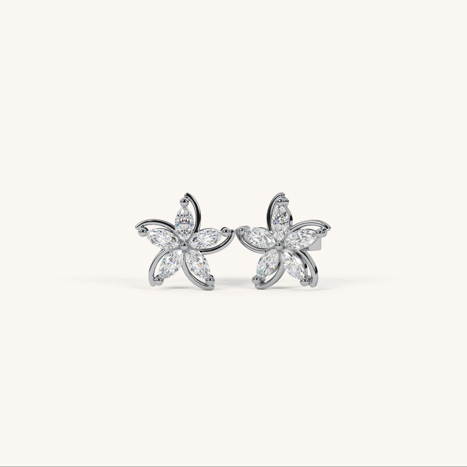 Pair of diamond stud earrings on a white background