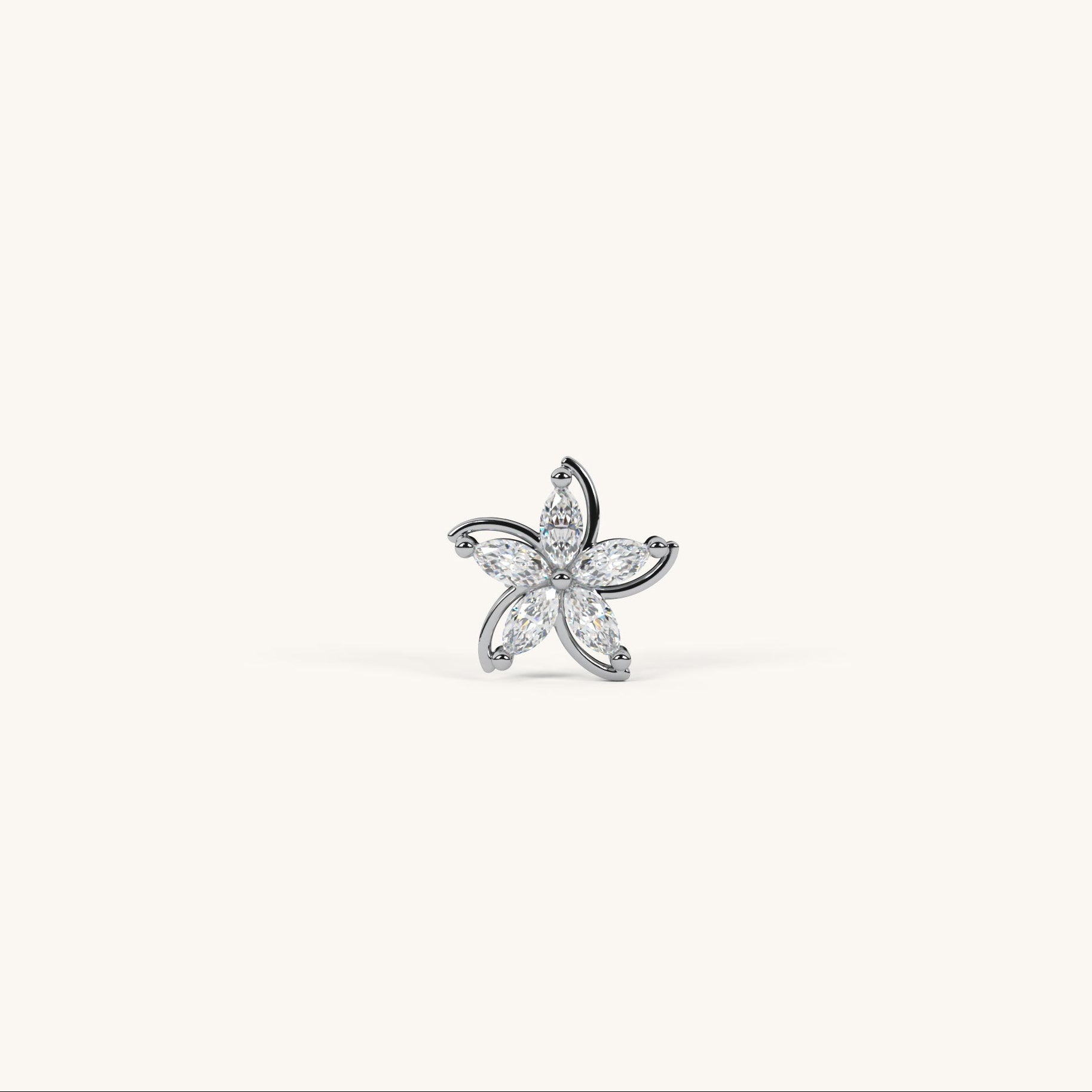 Star-shaped earring with clear stones on a white background