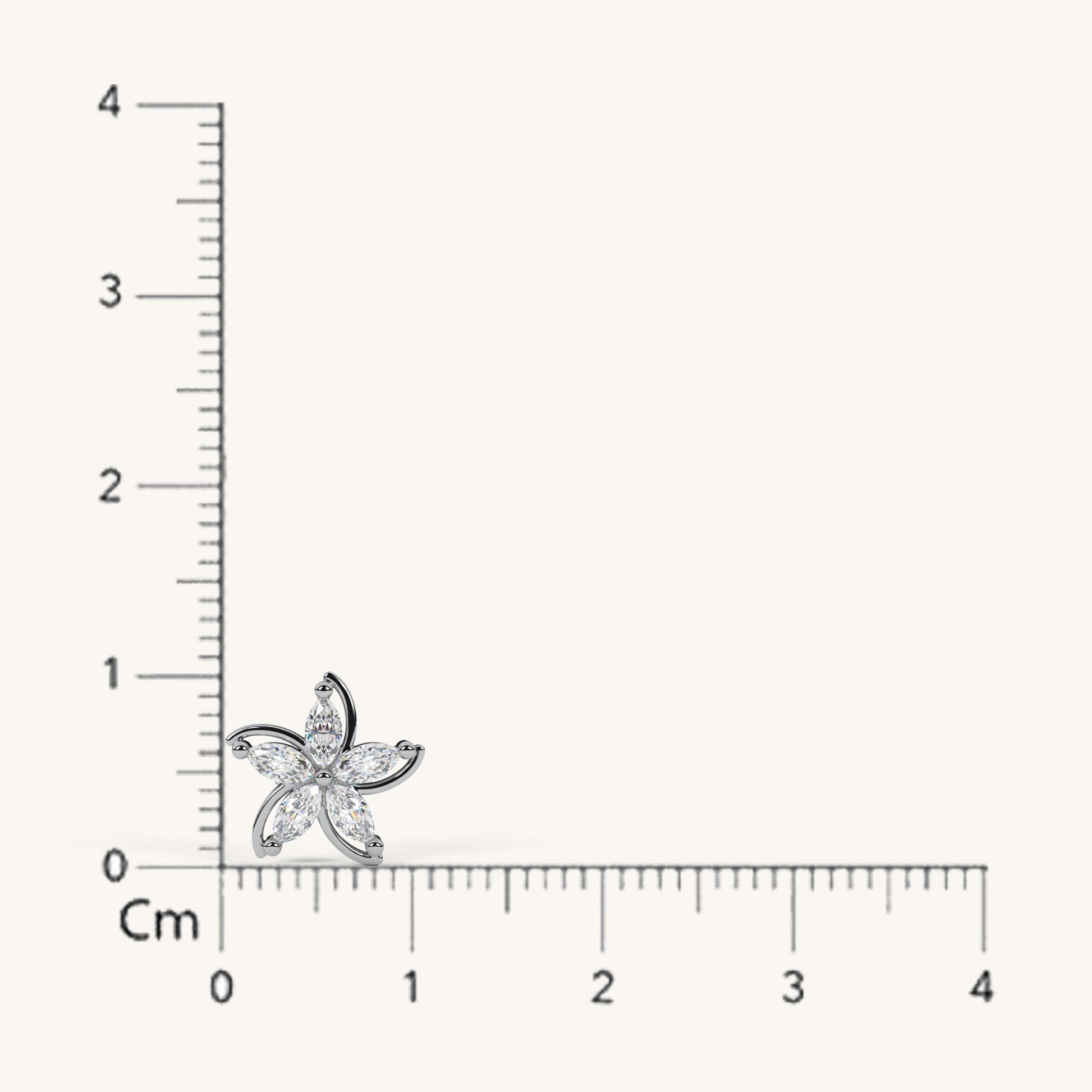 Starfish-shaped pendant with a ruler for scale on a white background