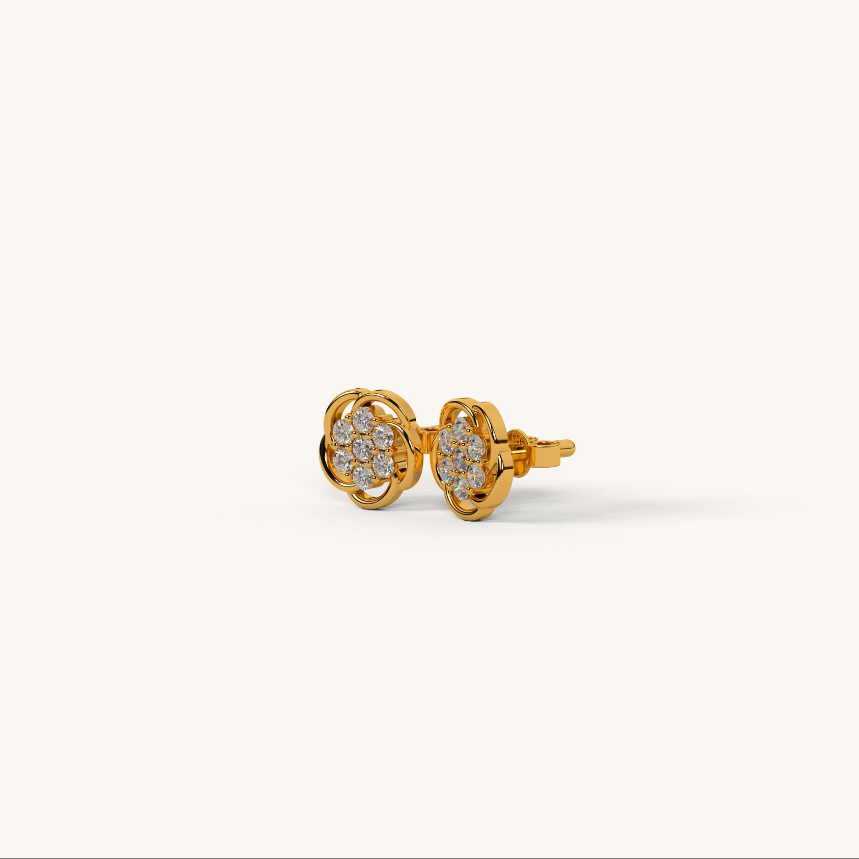 Gold Polish earrings with clear gemstones on a white background