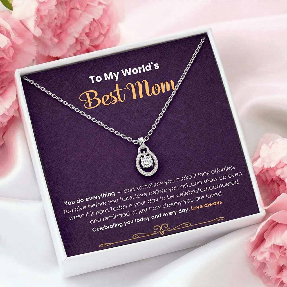 Necklace with a message card for 'Best Mom' on a pink floral background