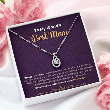 Necklace with a message card for 'Best Mom' on a pink floral background